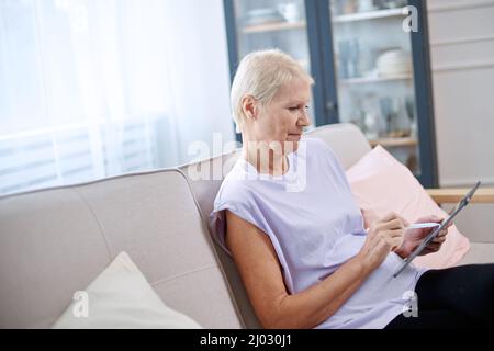 elderly woman is a designer doing some work. Stock Photo