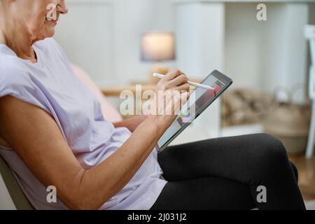 female designer with a tablet working on a new project. Stock Photo