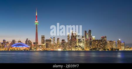 Toronto skyline featuring the CN Tower at night across Lake Ontario, Toronto, Ontario, Canada, North America Stock Photo