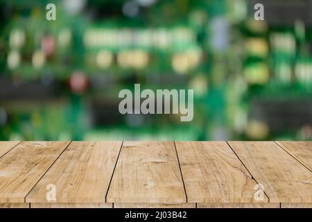 blur electronic printed circuit board with wooden table space for montage products advertising background. Stock Photo