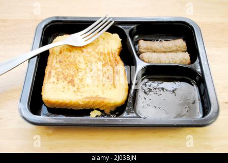 Frozen Precooked Microwave Breakfast of French Toast, Maple syrup and Sausage Links Stock Photo