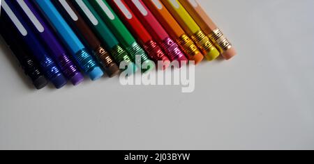 Several colored pencils with eraser on the tip of the same color Stock Photo