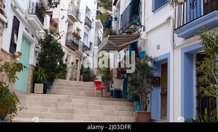 Santa Cruz is the oldest quarter of Alicante on the slope of Mount Benacantil and features narrow cobbled sloping streets Stock Photo