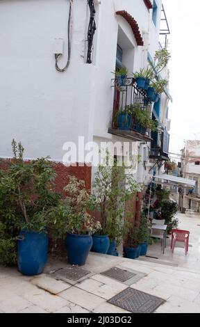 Santa Cruz is the oldest quarter of Alicante on the slope of Mount Benacantil and features narrow cobbled sloping streets Stock Photo