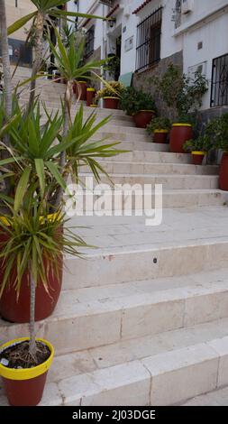 Santa Cruz is the oldest quarter of Alicante on the slope of Mount Benacantil and features narrow cobbled sloping streets Stock Photo