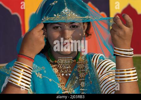 Oct. 07 2006 Portrait of Traditional Indian rural girl woman in sari costume covered her head with veil. Rajasthan female with face partially covered. Stock Photo