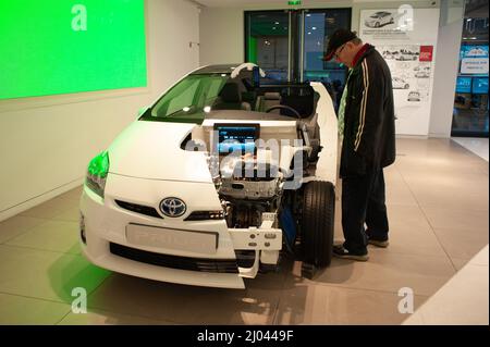 Paris, France, Man Shopping in  New Car Showroom, Toyota Concept Car, 'CSRS' Prius Model, Cut-Away View on display, electric cars for sale Stock Photo