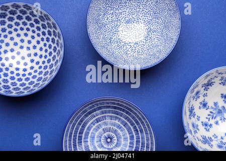 Chinese bowls on color background Stock Photo