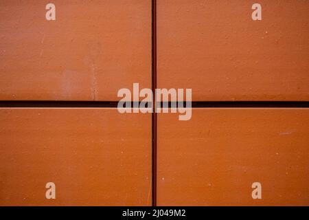 Epsom Surrey London UK, March16 2022, Red Ceramic Stone Wall Tile Cladding On Building Exterior With No People Stock Photo