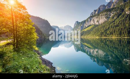 Fantastic azure alpine lake Vorderer Gosausee. Unusual and picturesque scene. Salzkammergut is a famous resort area located in the Gosau Valley in Upp Stock Photo