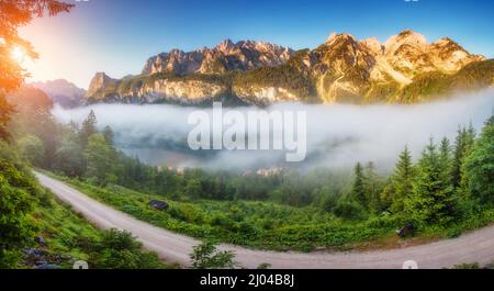 Fantastic azure alpine lake Vorderer Gosausee at dawn. Unusual and picturesque scene. Salzkammergut is a famous resort area located in the Gosau Valle Stock Photo