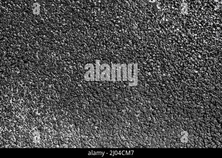 The texture of fresh asphalt of dark color wet from water and shiny surface Stock Photo