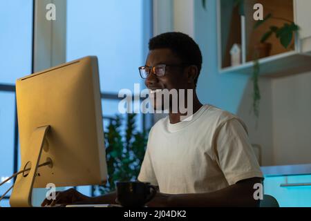 Happy successful programmer enjoy working from home on remote or freelance website or app project Stock Photo