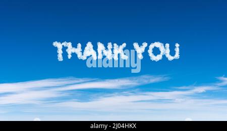 Thank you phrase made of clouds on blue sky background Stock Photo