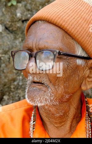 Amreli Gujarat India Asia Sep. 25 2009 - Portrait of Asian Indian Old Man Priest Sadhu of 90 years wearing Orange Colour Cap and Kurta or Shirt Stock Photo