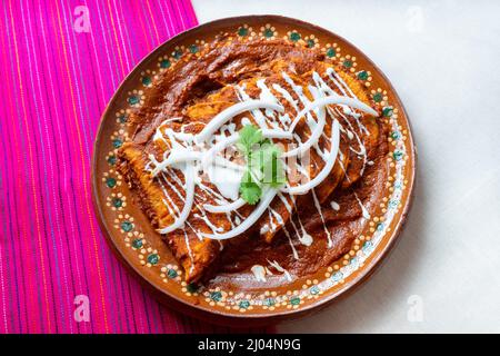 Traditional mexican red enchiladas Stock Photo