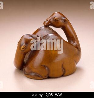 Camel Pair. Japan, second quarter of 19th century. Costumes; Accessories. Wood with inlays Stock Photo