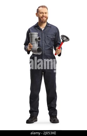 Full length portrait of a plumber holding a plastic pipe and a toilet plunger isolated on white background Stock Photo