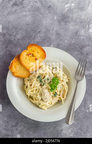 Creamy White Spaghetti Chicken Pasta with Fresh Parsley, Italian Food Photography Stock Photo