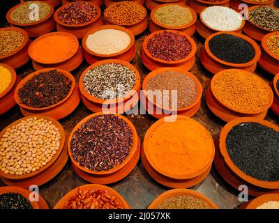 Cereals, grains, and spices in clay pots Stock Photo