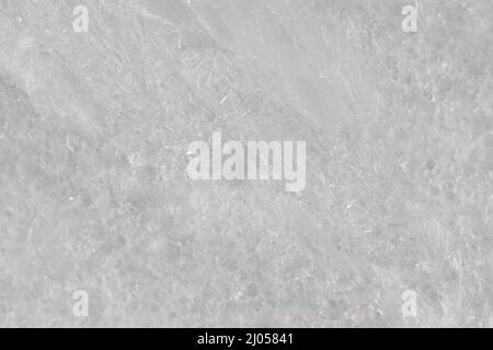 Natural stone tile in light gray color with scratches and marble effect. Stock Photo
