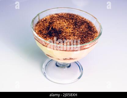 Tiramisu cream in a glass bowl isolated on white Stock Photo