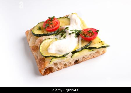 A piece of pizza al taglio with tomato and mozzarella isolated on white background Stock Photo