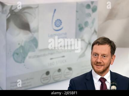 14 March 2022, Saxony, Oederan: Michael Kretschmer (CDU), Minister President of Saxony, gives a welcoming speech at Lemoine Germany GmbH, manufacturer of cotton swabs. The company with 100 employees is relying more on paper instead of plastic for packaging. To this end, a new packaging plant was put into operation on the same day. The cotton swabs are now packed in paper bags instead of plastic bags before they are sold in drugstores and supermarkets. The new packaging is made from 100 percent recycled paper and is manufactured entirely in Saxony. According to the company, more than two millio Stock Photo