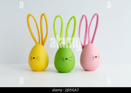 Colorful Easter eggs with bunny faces, holiday decoration Stock Photo
