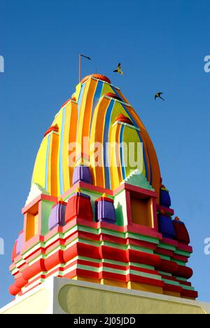 Amreli; Gujarat; india : Sep. 22; 2009 - Colourful Hindu Temple of God Shiva Place of Worship with Blue Sky in Background; District Amreli Stock Photo