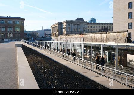 Berlin, Germany, March 1, 2022, view of the visitors gallery in the Topography of Terror with the Berlin Wall, the House of Representatives and the Ma Stock Photo