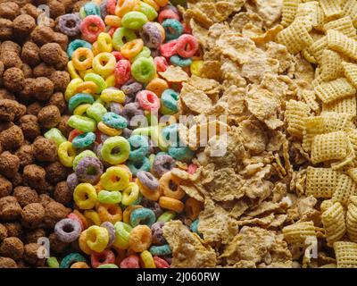 Various whole grain products, healthy snacks - chocolate balls, fruit rings, crunchy pads and cereals. Assorted whole grain quick breakfasts. Healthy Stock Photo