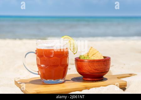 Michelada beer and guacamole at mexican beach Stock Photo
