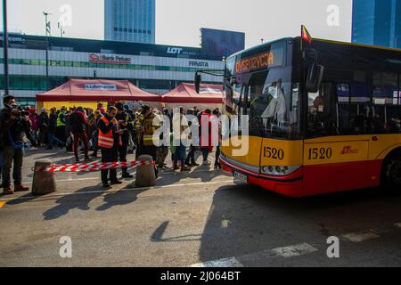 Warsaw, Poland. 16th Mar, 2022. A bus for Ukrainian refugees waits to be loaded. Ukrainian citizens flee to Poland to escape violence from the Russian invasion. A stop for many is the Warsaw central station. (Photo by Ty O'Neil/SOPA Images/Sipa USA) Credit: Sipa USA/Alamy Live News Stock Photo