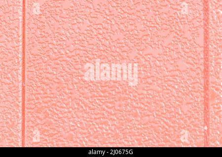colorful textured flat wall in shades of warm red and pink Stock Photo