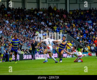 Warrington 16 July 2015: Warrington Wolves hosted St Helens at the Halliwell Jones Stadium. Two St Helens players make a tackle Stock Photo
