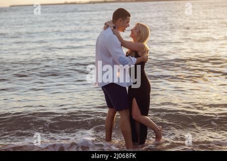 Full-length photo of couple dancing by the sea Stock Photo