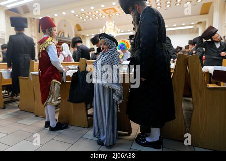 (220316) -- ASHDOD (ISRAEL), March 16, 2022 (Xinhua) -- Ultra-Orthodox Jews attend a reading of the Megillat Esther during the Jewish holiday of Purim at a synagogue in Ashdod, southern Israel, on March 16, 2022. Purim is a Jewish holiday that commemorates the deliverance of the Jewish people from Haman's plot during the reign of the ancient Persian Empire, according to the Biblical Book of Esther. (Ilan Assayag/JINI via Xinhua) Stock Photo