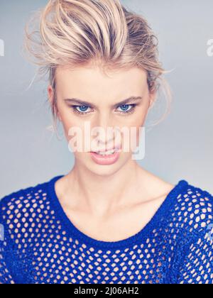 Posing with confidence. Studio shot of a beautiful young woman posing in the studio. Stock Photo