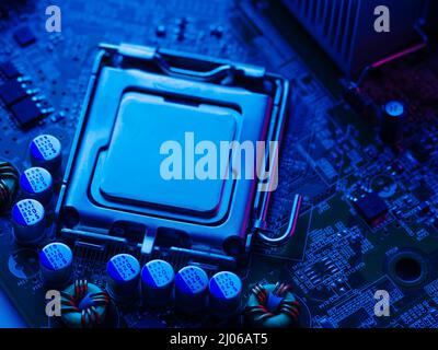 Processor, desktop microprocessor on a blue surface close-up. Semiconductor contacts and connectors. Electronic and computer equipment. Hardware, repa Stock Photo