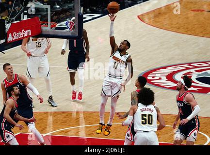 Washington, USA. 16th Mar, 2022. WASHINGTON, DC - MARCH 06: Denver Nuggets guard Monte Morris (11) goes up unopposed for a score during a NBA game between the Washington Wizards and the Denver Nuggets, on March 16, 2022, at Capital One Arena, in Washington, DC. (Photo by Tony Quinn/SipaUSA) Credit: Sipa USA/Alamy Live News Stock Photo