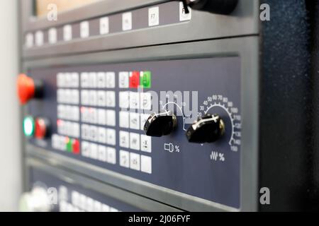 Keys and switches on a CNC control panel. Selective focus. Stock Photo
