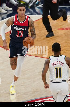 Washington, USA. 16th Mar, 2022. WASHINGTON, DC - MARCH 06: Washington Wizards forward Kyle Kuzma (33) dribbles up to Denver Nuggets guard Monte Morris (11) during a NBA game between the Washington Wizards and the Denver Nuggets, on March 16, 2022, at Capital One Arena, in Washington, DC. (Photo by Tony Quinn/SipaUSA) Credit: Sipa USA/Alamy Live News Stock Photo