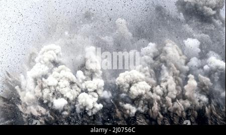 Extremely close up of dust storm during electronic serial detonator blasting on the mining site in the Middle east Stock Photo