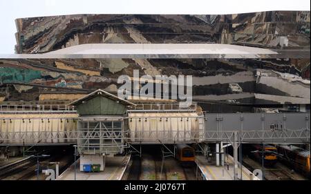 Birmingham, UK - 15-March-2022 - On an overcast day in March, the mirrored cladding of the Grand Central complex above New Street Station creates a set of surreal reflections. Stock Photo