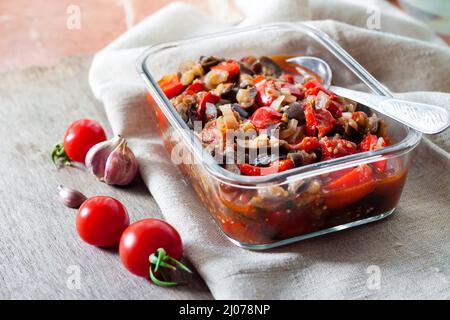 Vegetable sauté with eggplant, red bell pepper and tomatoes Stock Photo