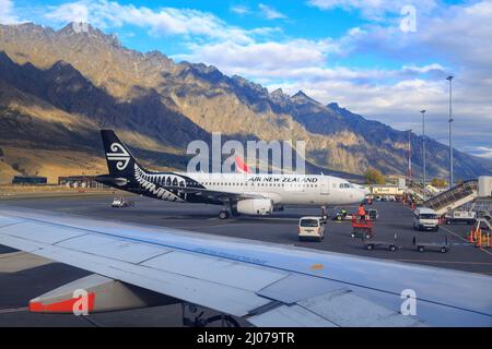 An Air New Zealand Airbus A320-232 with a koru and fern leaf on its tail, at Queenstown Airport, Queenstown, NZ Stock Photo