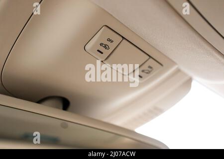 Closeup of cabin lights switch in car, light control panel inside a car interior. For reading etc. Stock Photo