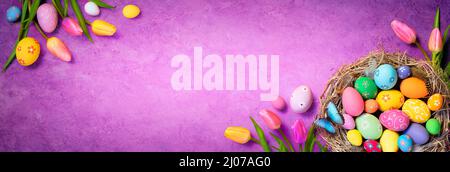 Easter Eggs - Tulips And Decorations On Velvet Violet Background Stock Photo