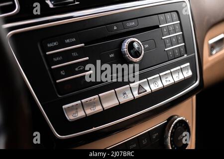 Modern car dashboard with multimedia screen. Interior detail, luxury vehicle close-up view background Stock Photo